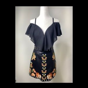 Leather mini skirt studded with prints